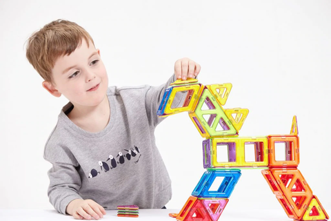 a boy and a deer made of magnetic tiles