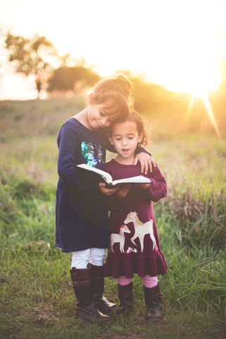 children are reading books with sunshine