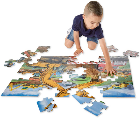 a boy working on a puzzle