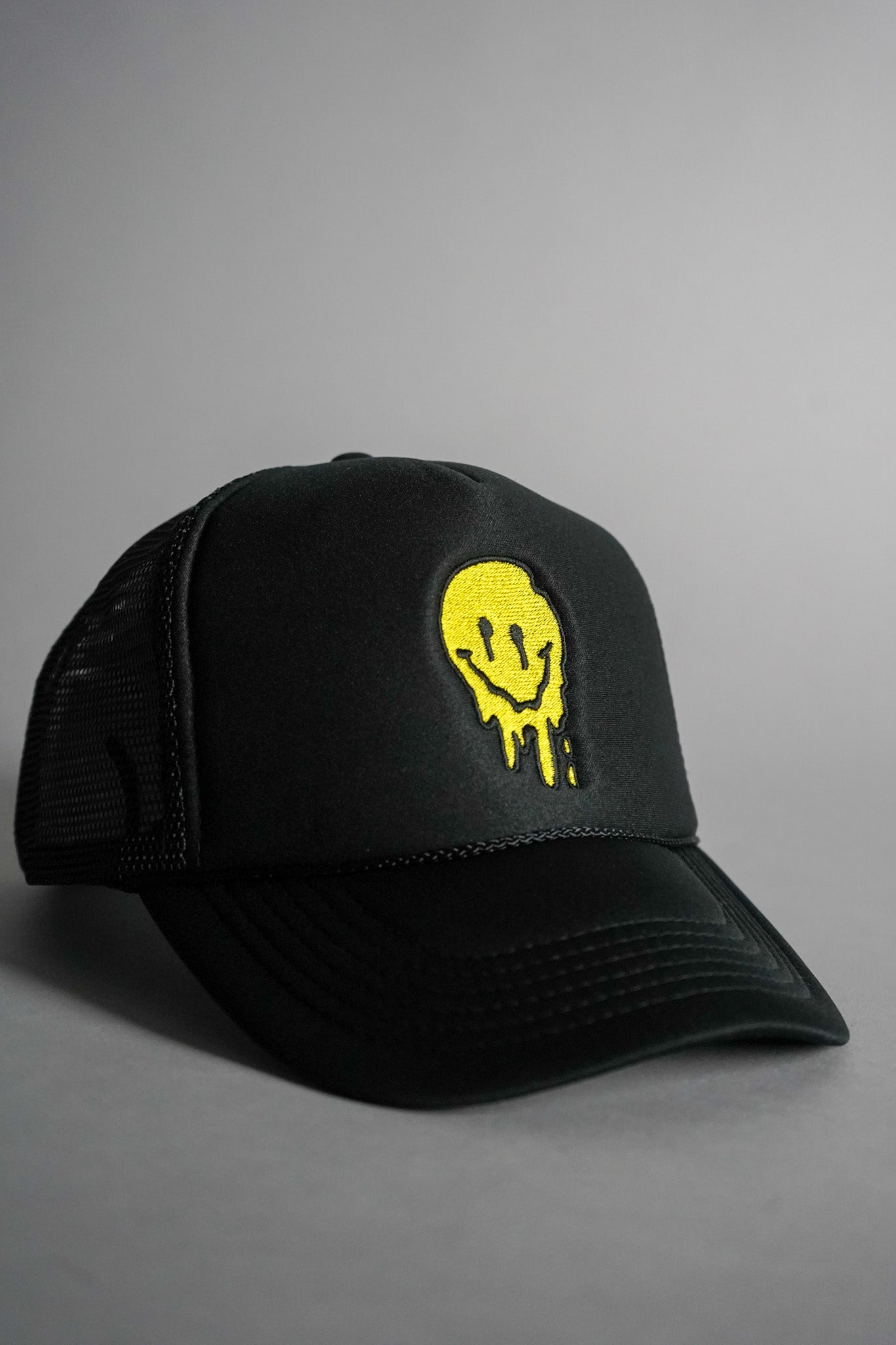 Melted Smiley Face Trucker Hat - Black