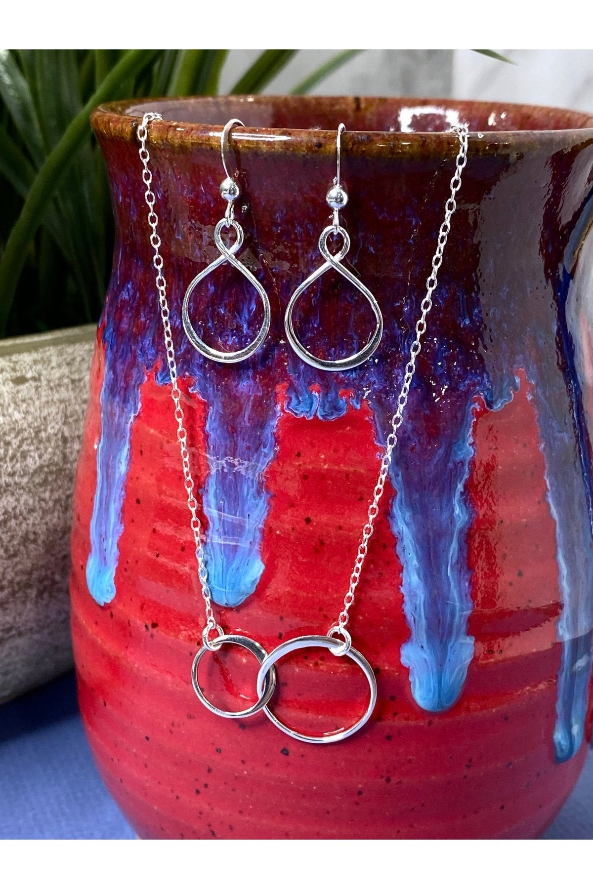 Two Intertwined Circle Sideways Necklace in Sterling Silver