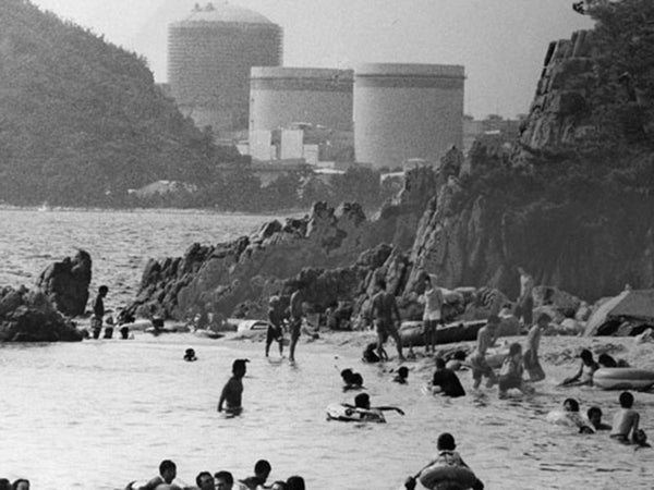 The Mihama Nuclear Power Plant in Japan is about 50 kilometers away from Kyoto. People are swimming on the beach near the nuclear power plant.