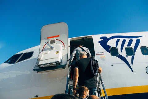 people are boarding a plane