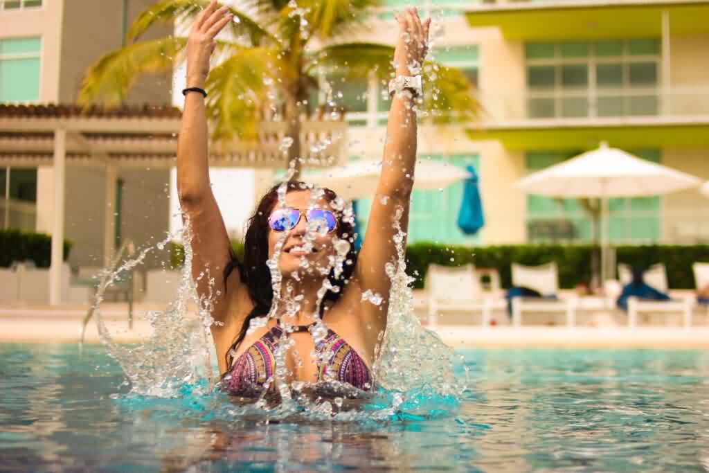 underarms hair removal lady splashing water in pool party