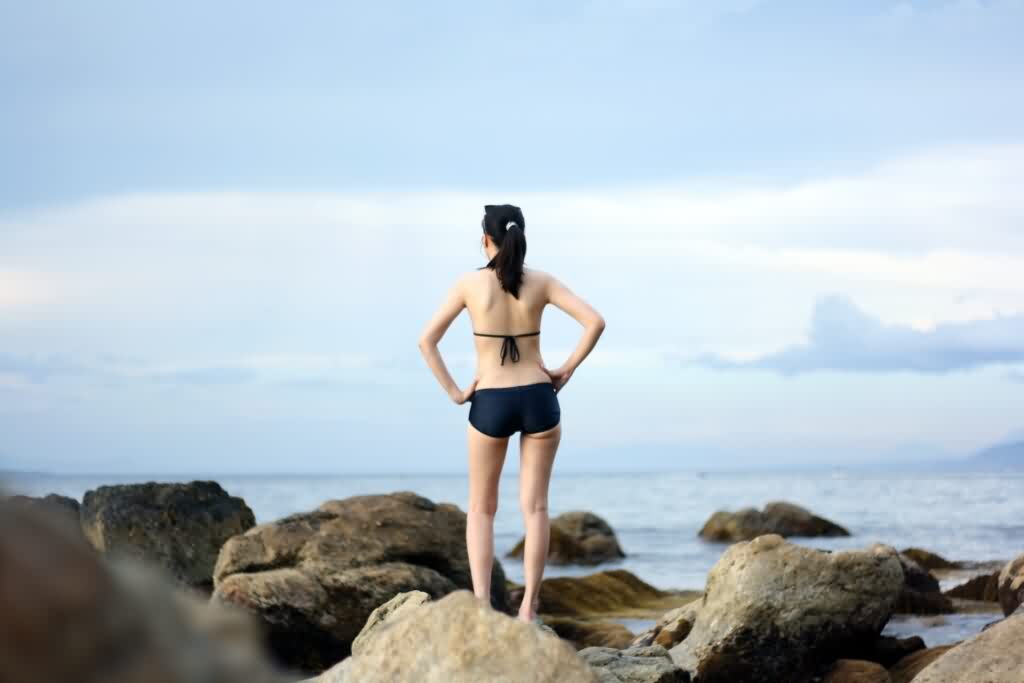 bikini hair removal woman standing near shore