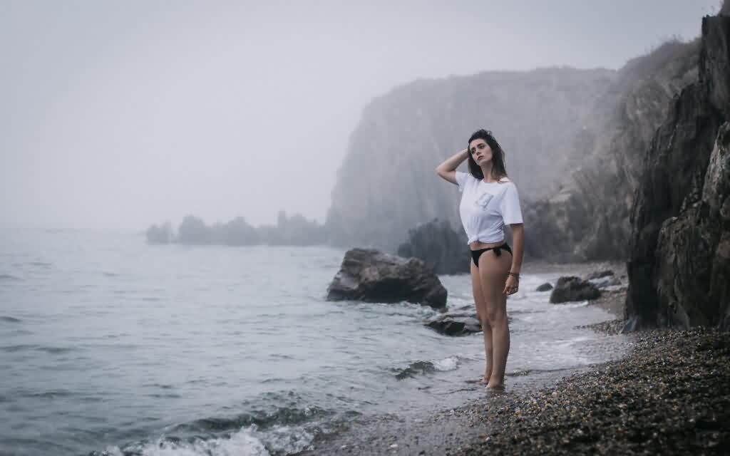 bikini laser hair removal girl standing next to the ocean