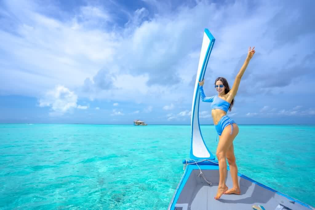 laser hair removal girl posing on a boat in Hawaii