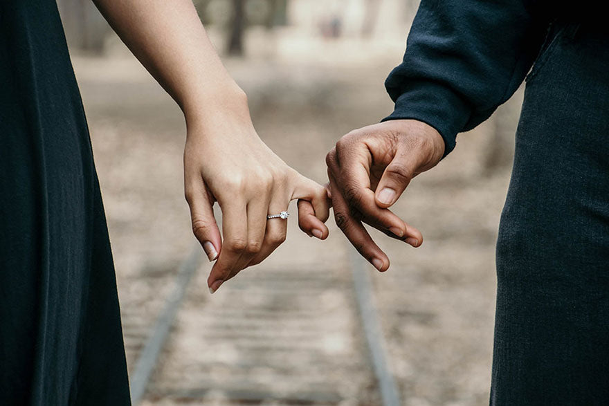 Engagement rings hand in hand