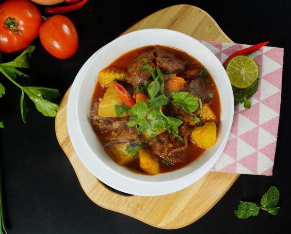 bowl of beef stew and potatoes