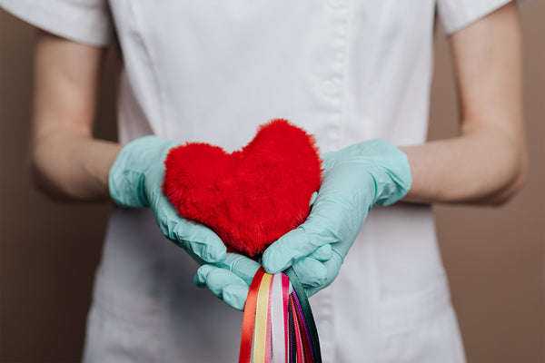 nurse holding a heart