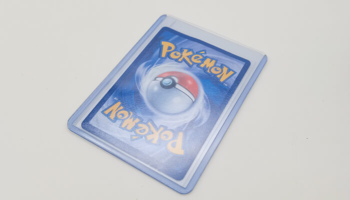 place pokemon trading card in toploader to protect them