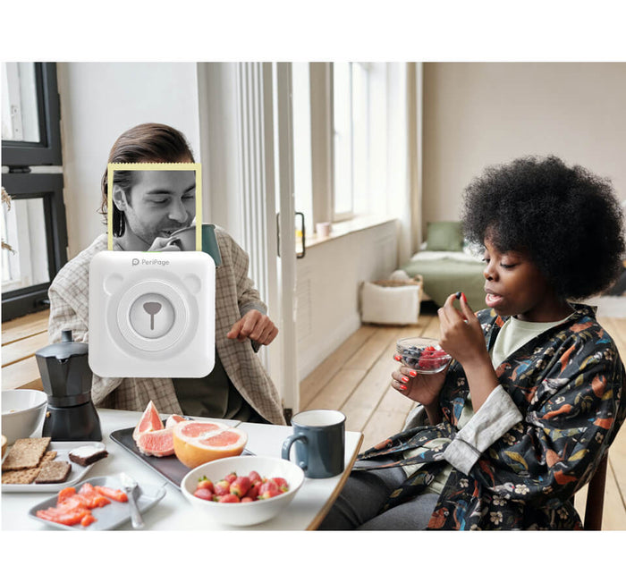 PeriPage 2" A6 Mini Printer in use during a casual breakfast setting, showcasing its compact and portable design for everyday use