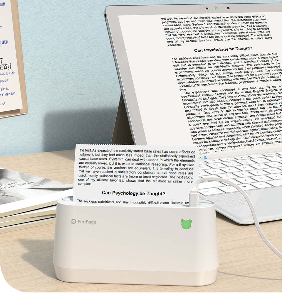 PeriPage A9 Max mini thermal printer connected to laptop printing document text, compact printer for notes and study use