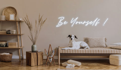a sentence of "be yourself!" in led neon sign