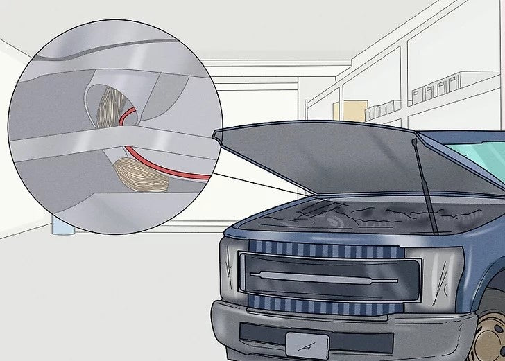 Acheminez les fils d'alimentation de la lumière à travers un trou dans le compartiment moteur.