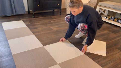 a women install Matace removable carpet squares