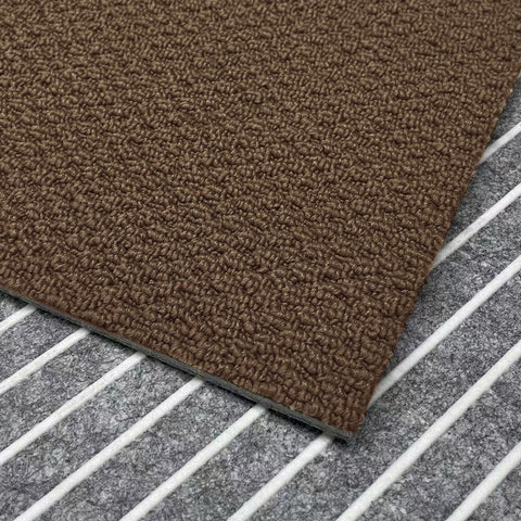 A close-up view of the brown Matace carpet sqares.