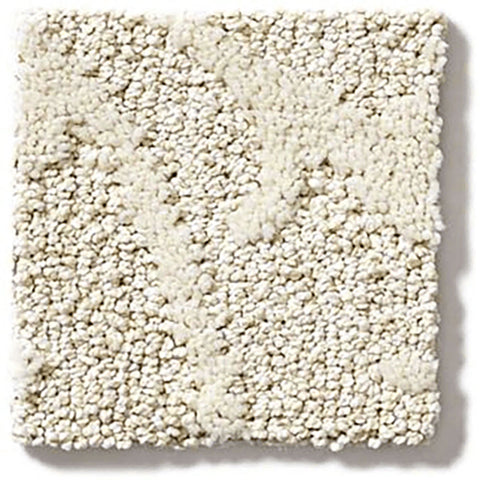 A square cream cut loop pile rug.