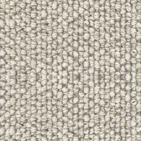 Detail of a white and gray loop pile rug.