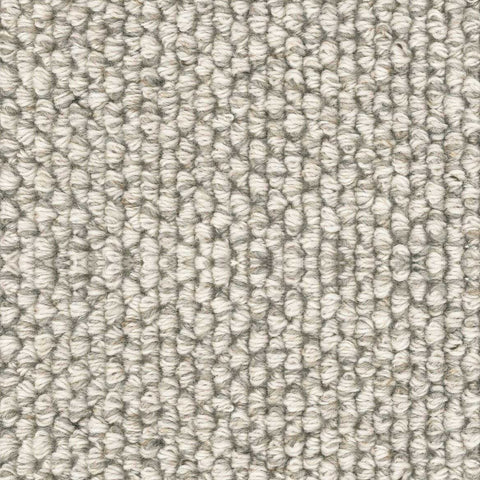 Detail of a white and gray loop pile rug.