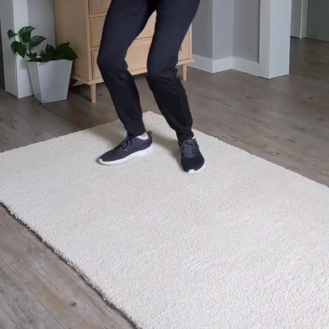 a women jump on the Matace removable carpet tile