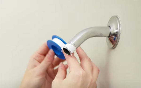 Apply new thread sealing tape to the shower arm