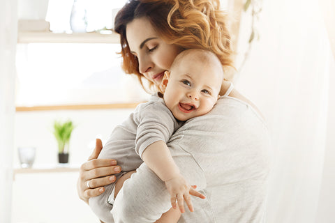 baby and parents playing