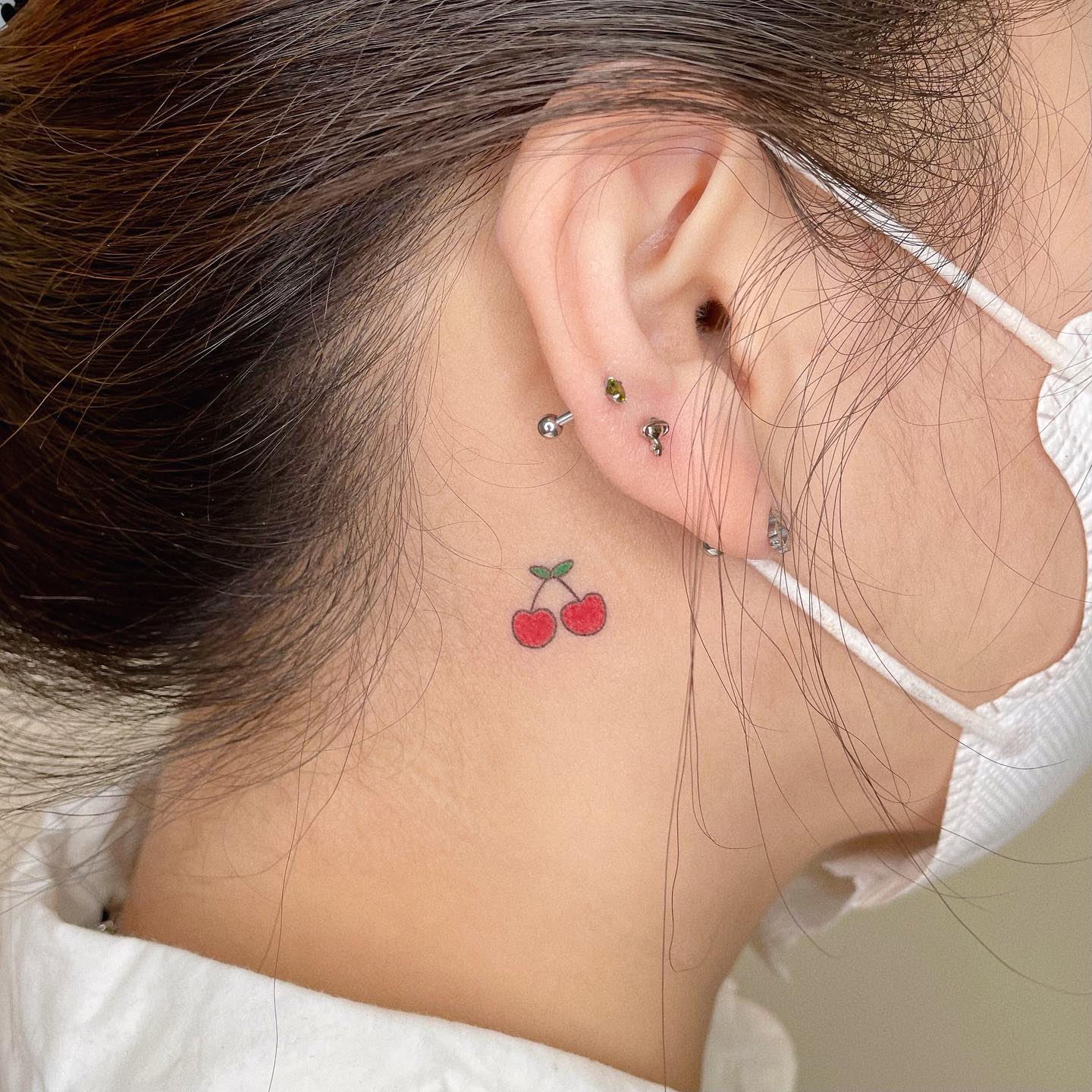 A Cherry Tattoo Behind Ear