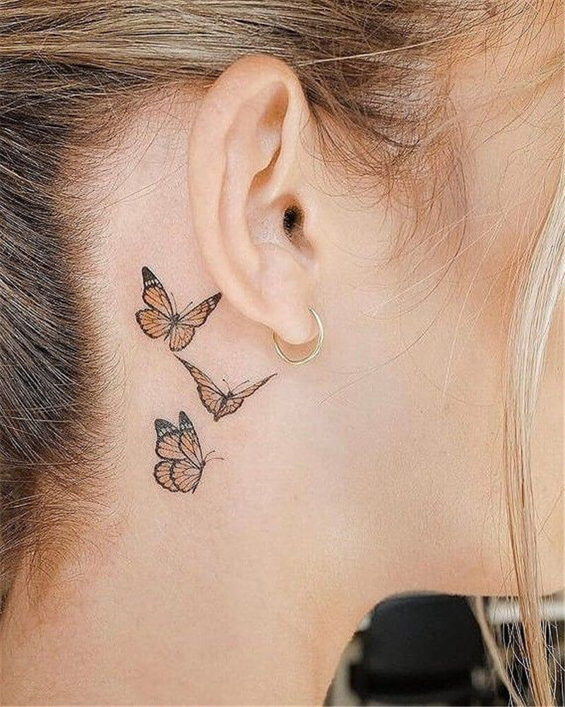 monarch butterfly tattoo behind ear