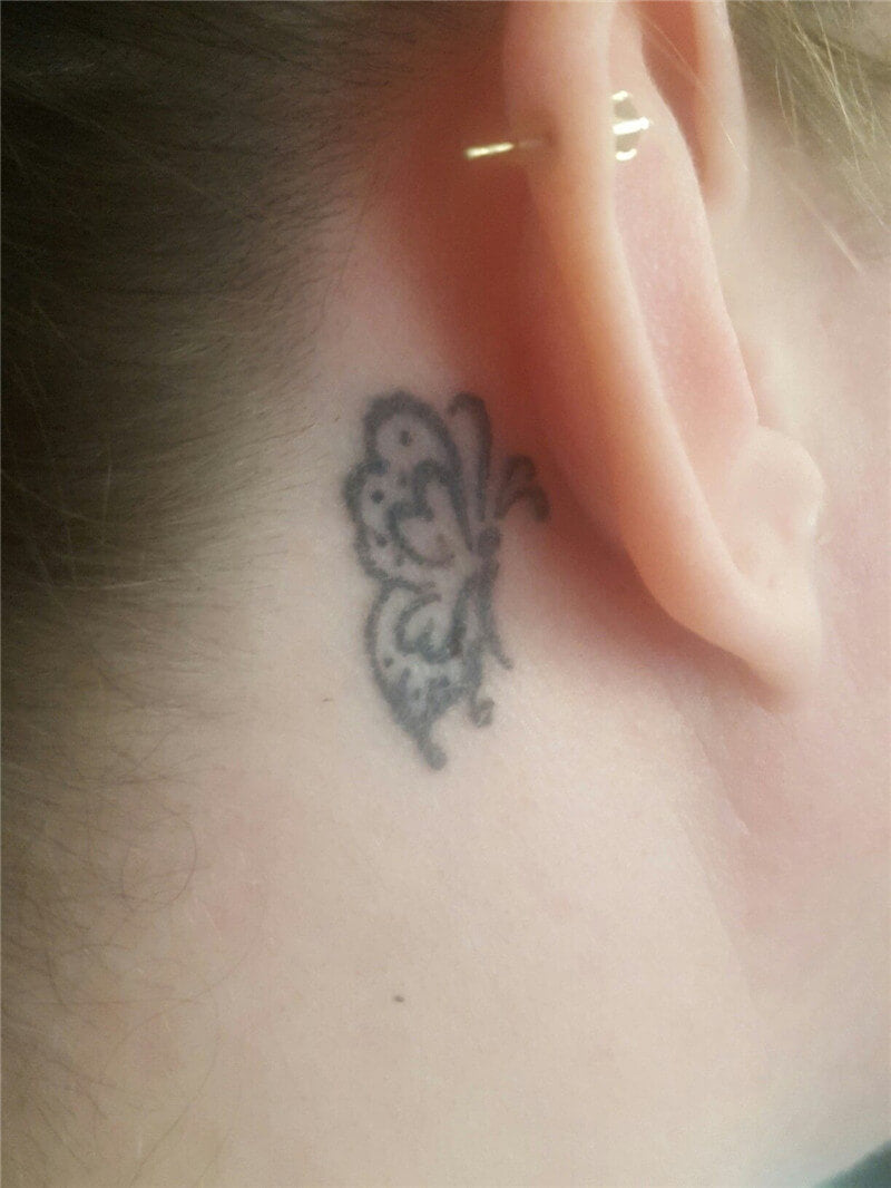 half butterfly tattoo behind ear