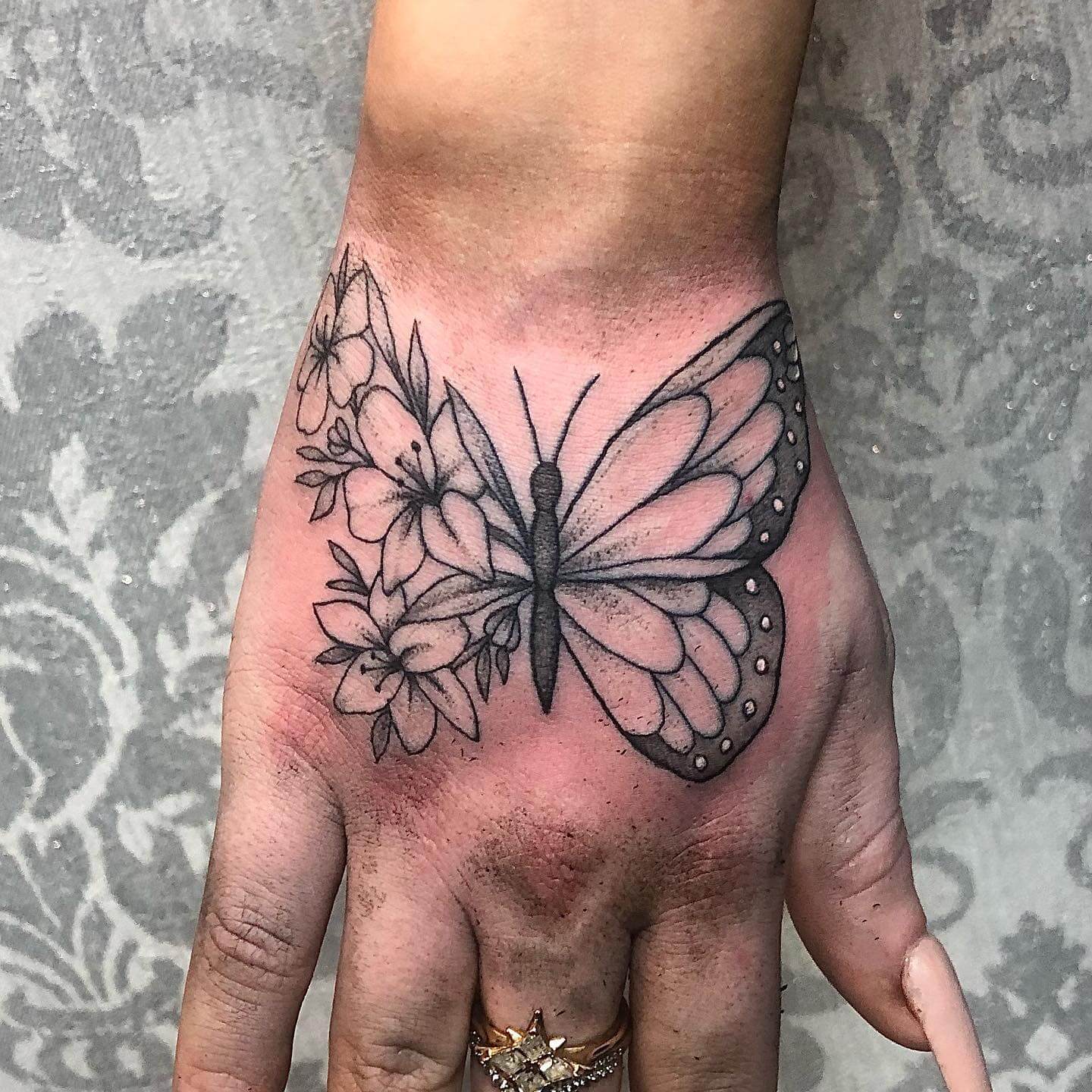 Flower and Butterfly Hand Tattoo