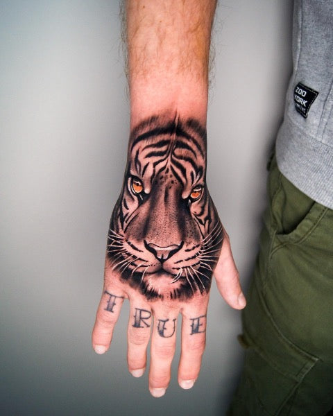 Lion Hand Tattoo