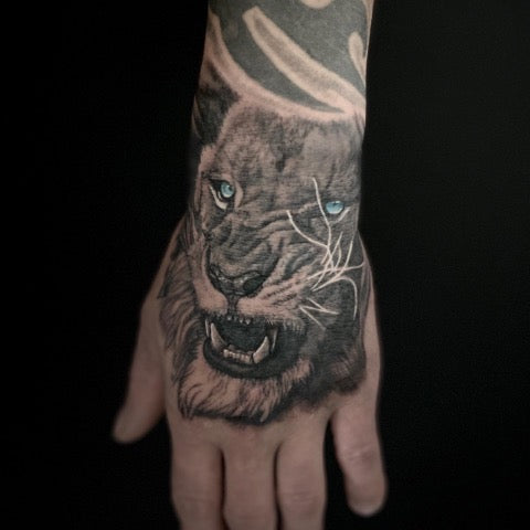 Lion Hand Tattoo