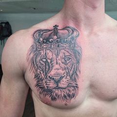 Lion With Crown On Chest Tattoo
