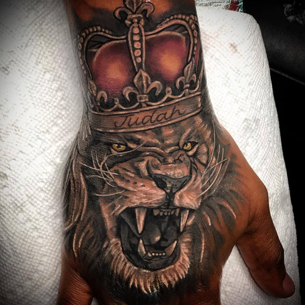 Lion With Crown Tattoo On Hand
