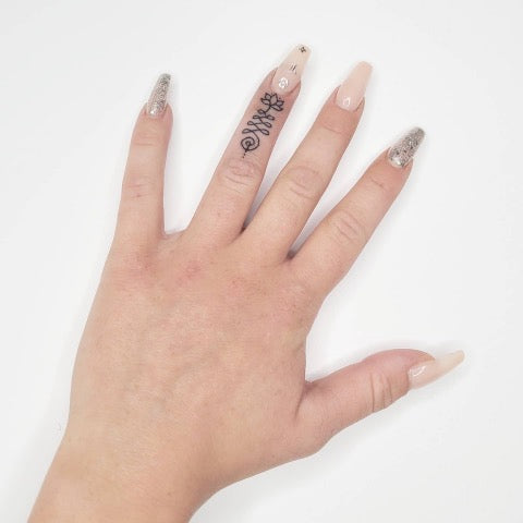 Mandala finger tattoo