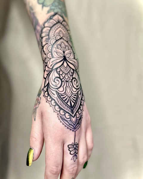 Mandala hand tattoo