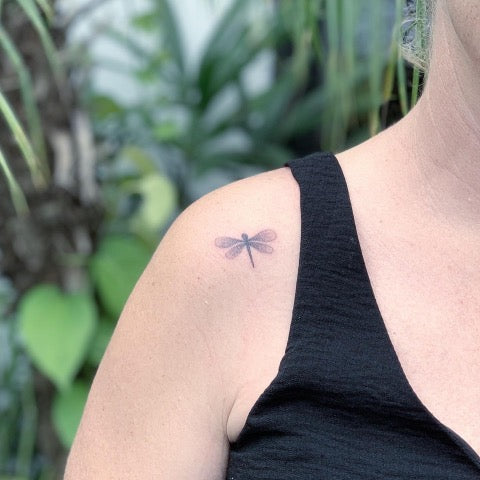 Minimalist matching dragonfly tattoo for mother and