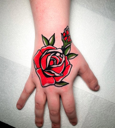 Simpe Rose Hand Tattoo This Is Most Definitely One Of My Favorite Rose  Tattoos Ive Done By Far rose rosetattoo handtattoo  Instagram