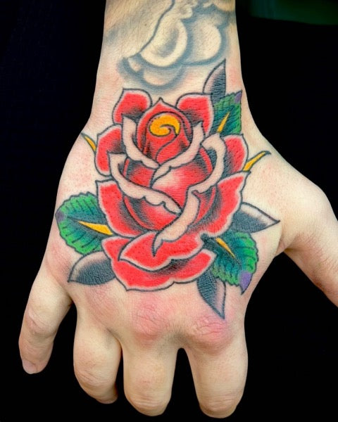 Neo Traditional Flower hand tattoo by Billy Williams TattooNOW
