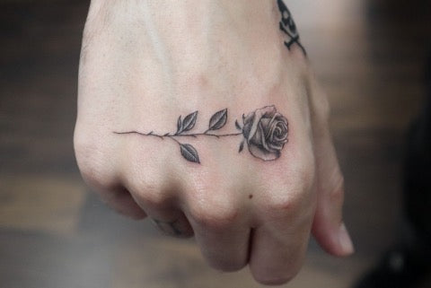 Small Rose Hand Tattoo