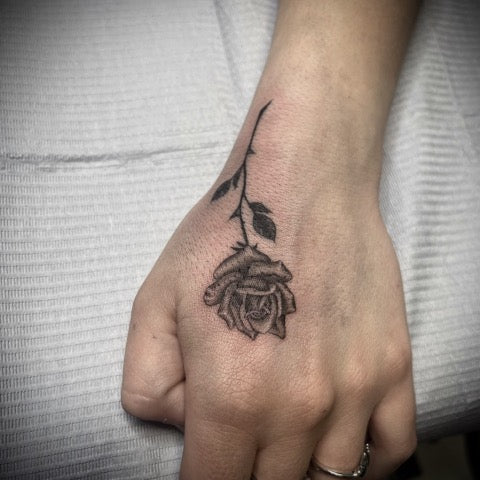 Small Rose Hand Tattoo