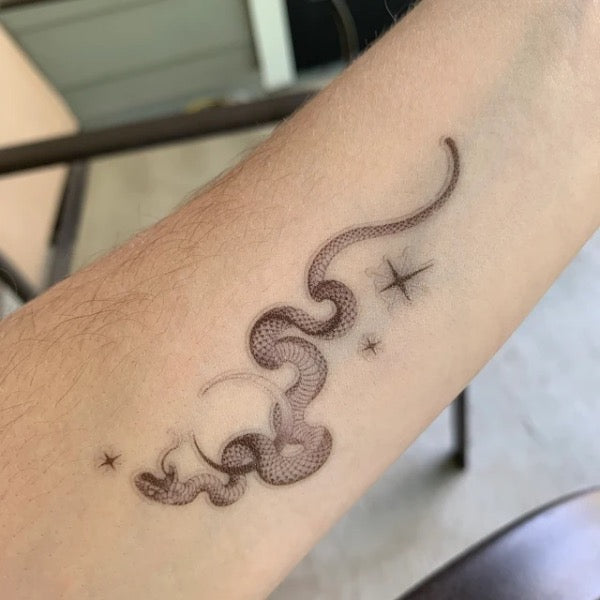 Snake and moon tattoo