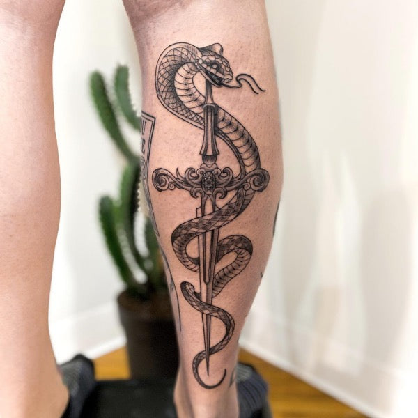 Sword & snake tattoo