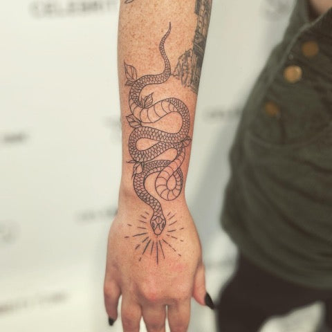 snake forearm tattoo