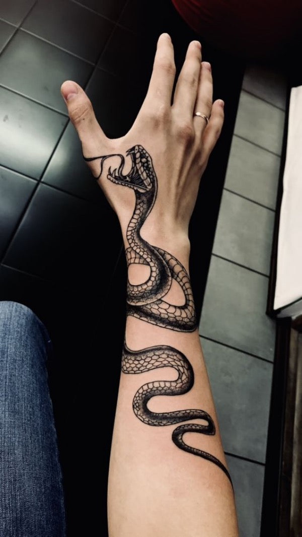 Snake on hand by Edwardemar Bonilla TattooNOW