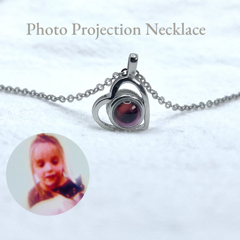 Customodish's personalized photo projection necklace can project its interior image onto a surface, just like a slide projector.