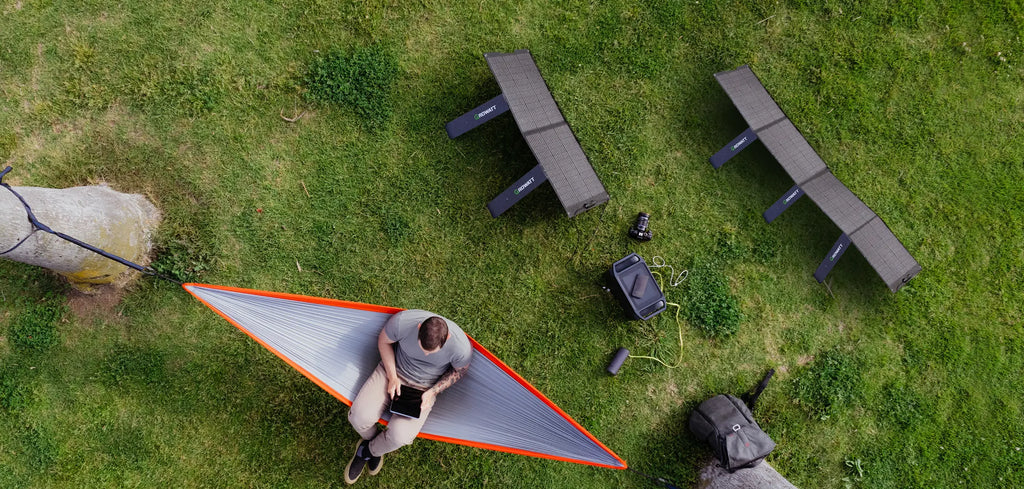 a man using solar powered battery pack - Growatt