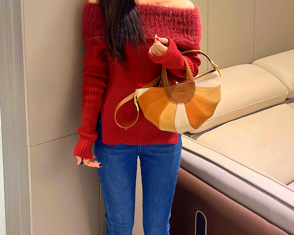 Example 3: A casual autumn outfit with dark blue jeans, a cozy sweater in a complementary color, and a rainbow purse. 