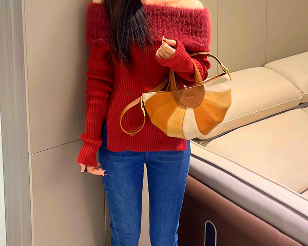 Example 3: A casual autumn outfit with dark blue jeans, a cozy sweater in a complementary color, and a rainbow purse.